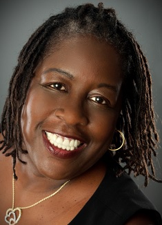 A person smiling for the camera

Description automatically generated